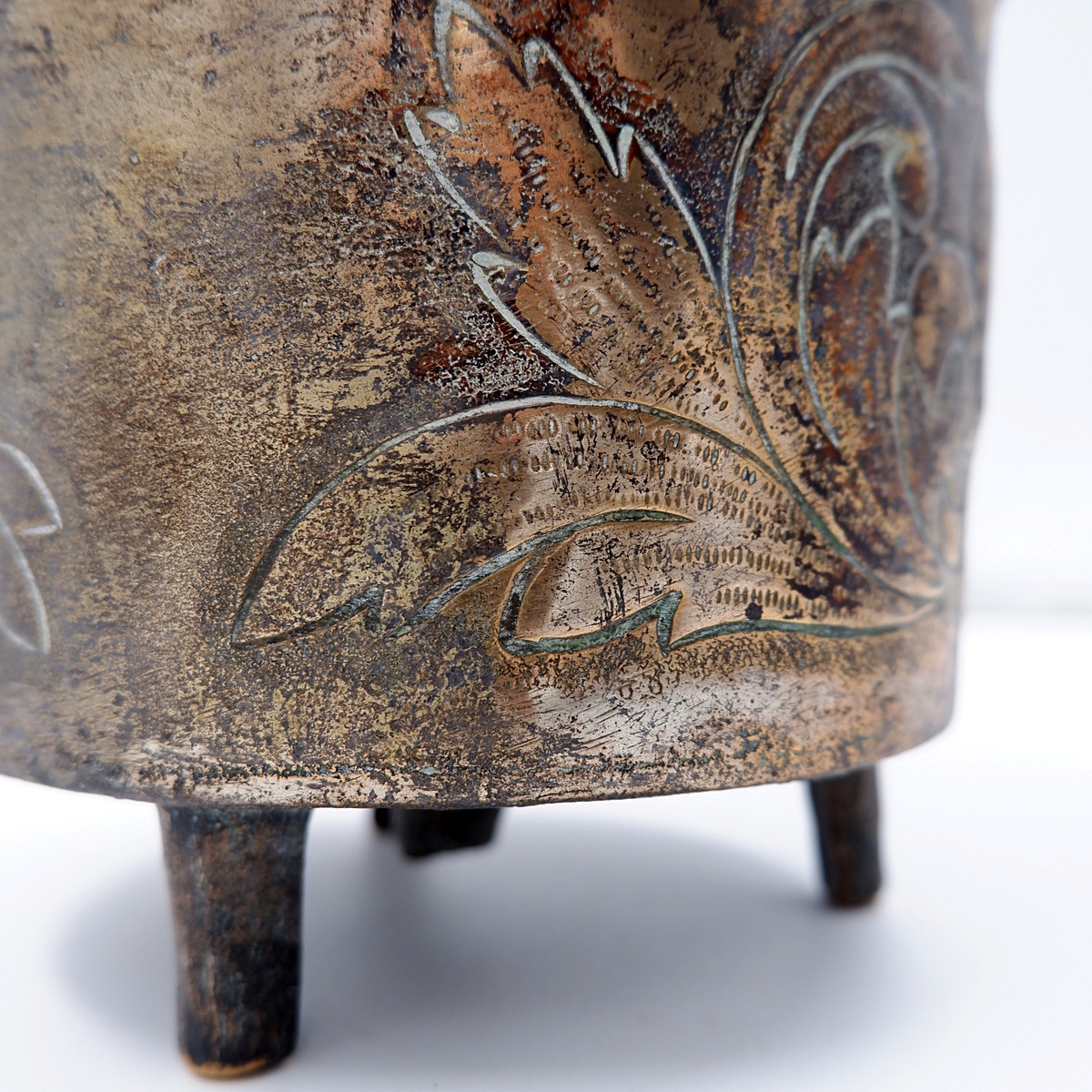 Small embossed copper cauldron with the 