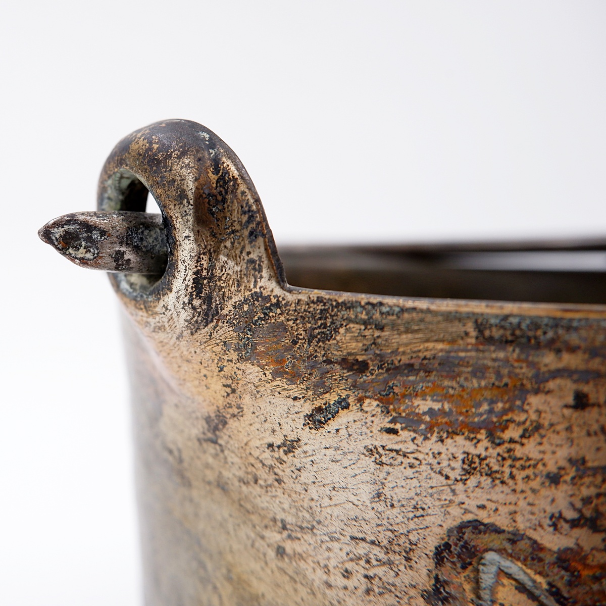 Small embossed copper cauldron with the 