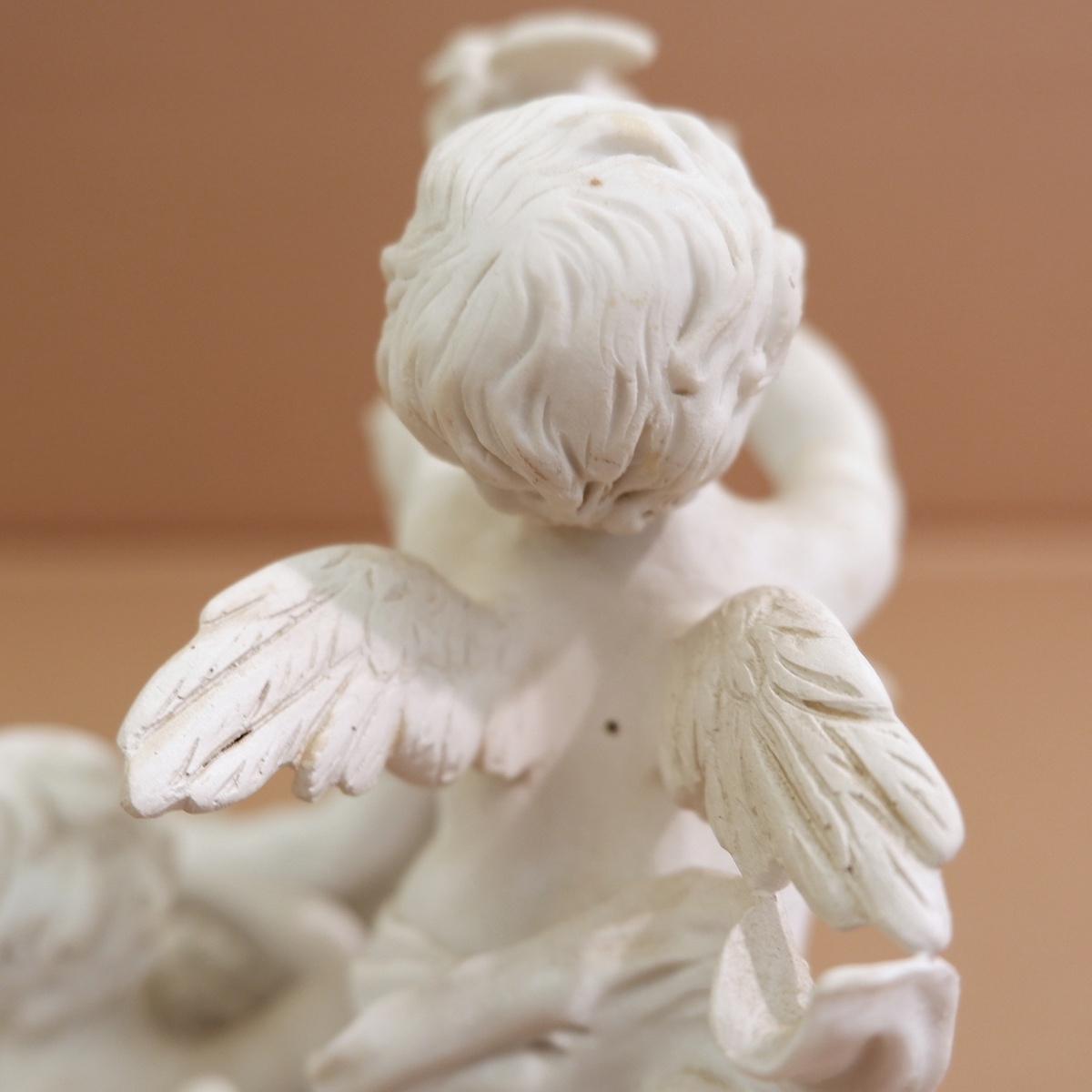 Three cherubs  in white porcelain biscuit 19th